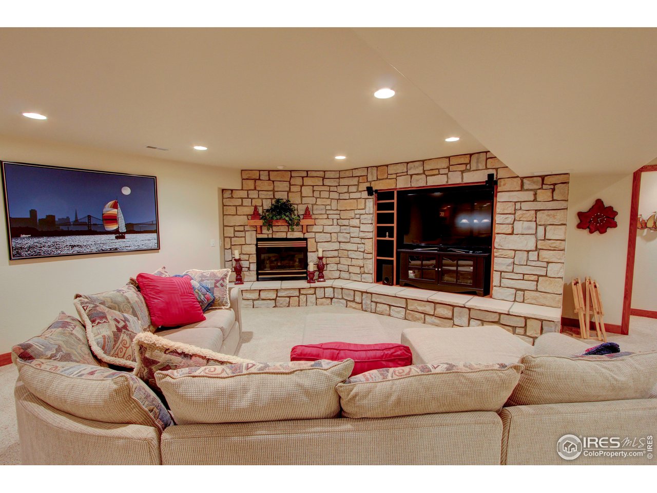 7848 Eagle Ranch Road Fort Collins, CO 80528 - Photo 27 of 46 a living room with furniture and a flat screen tv