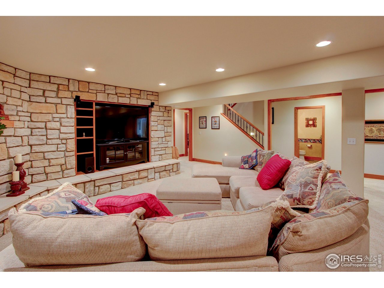 7848 Eagle Ranch Road Fort Collins, CO 80528 - Photo 28 of 46 a living room with furniture and a flat screen tv