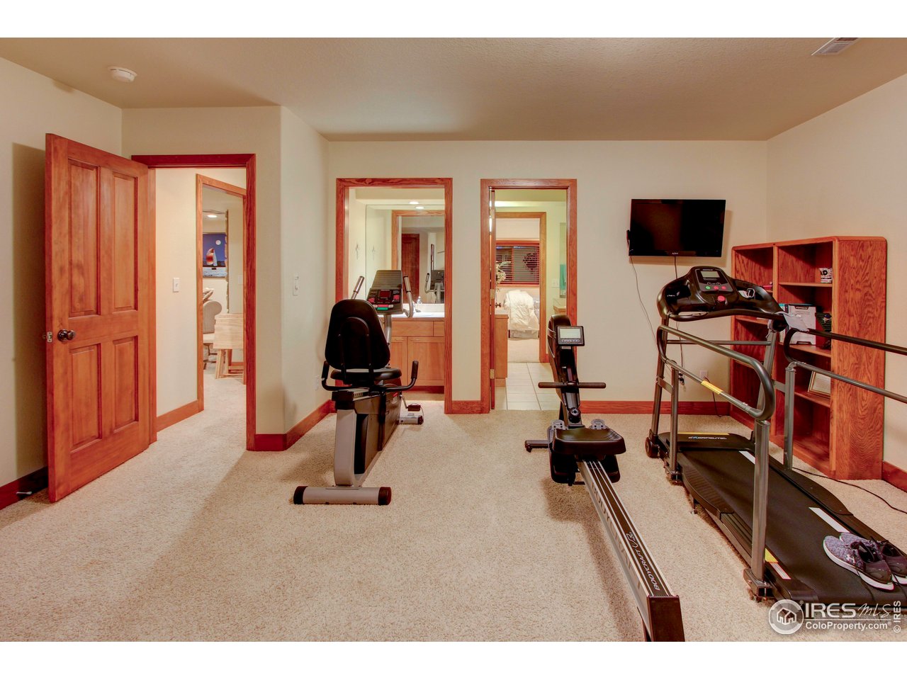 7848 Eagle Ranch Road Fort Collins, CO 80528 - Photo 36 of 46 a view of a living room with furniture and a flat screen tv