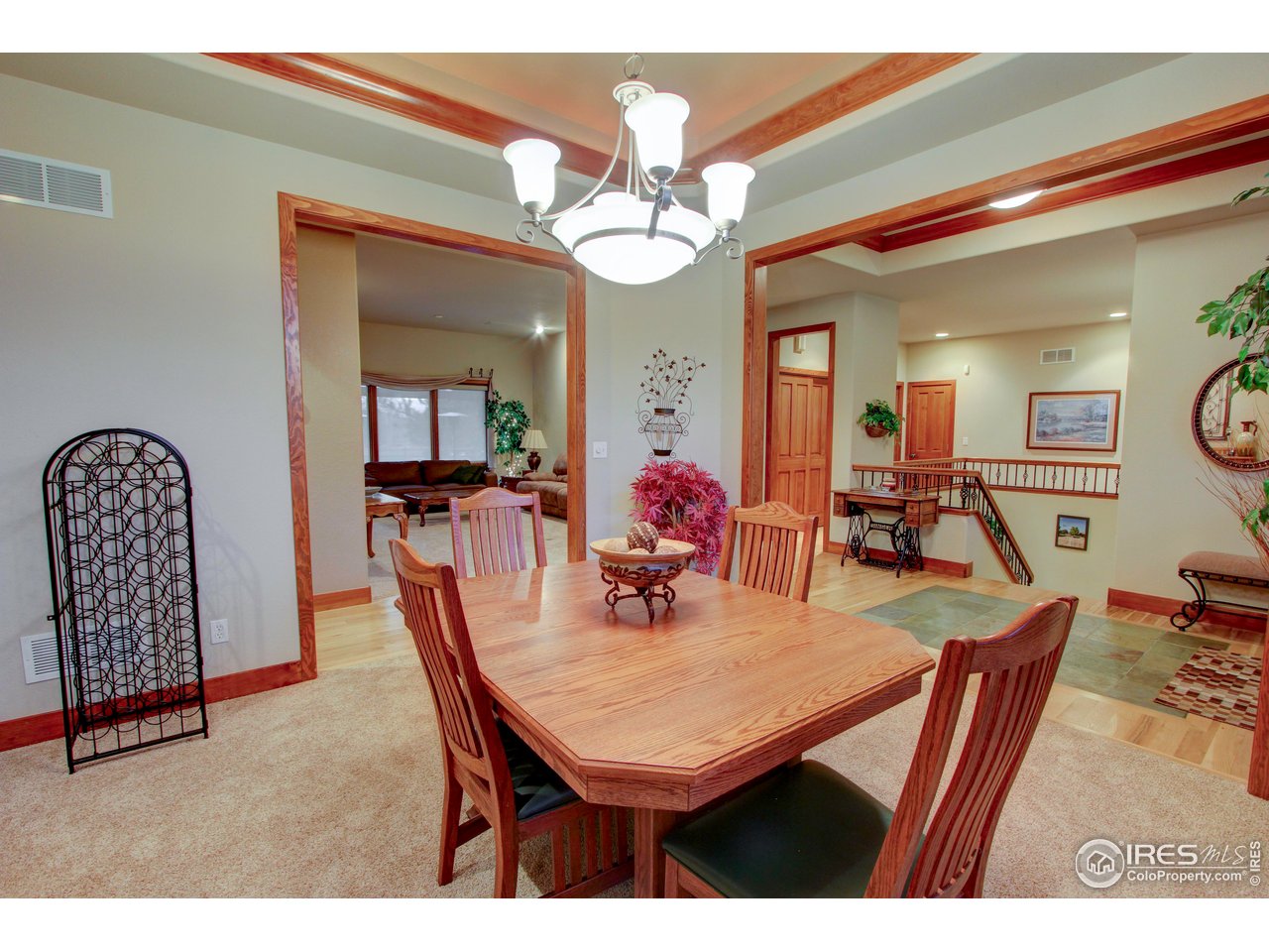 7848 Eagle Ranch Road Fort Collins, CO 80528 - Photo 7 of 46 a dining room with furniture and a chandelier