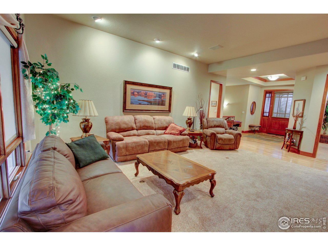 7848 Eagle Ranch Road Fort Collins, CO 80528 - Photo 9 of 46 a living room with furniture and a large window