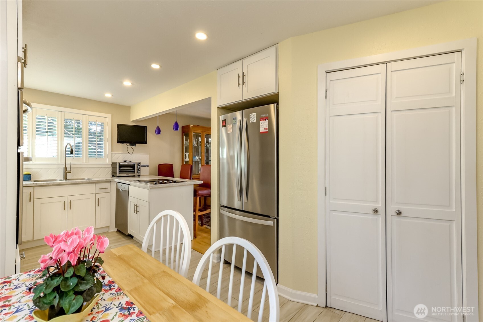 2424 Southwest 152nd Street Burien, WA 98166 - Photo 17 of 39 a kitchen with refrigerator a sink and cabinets