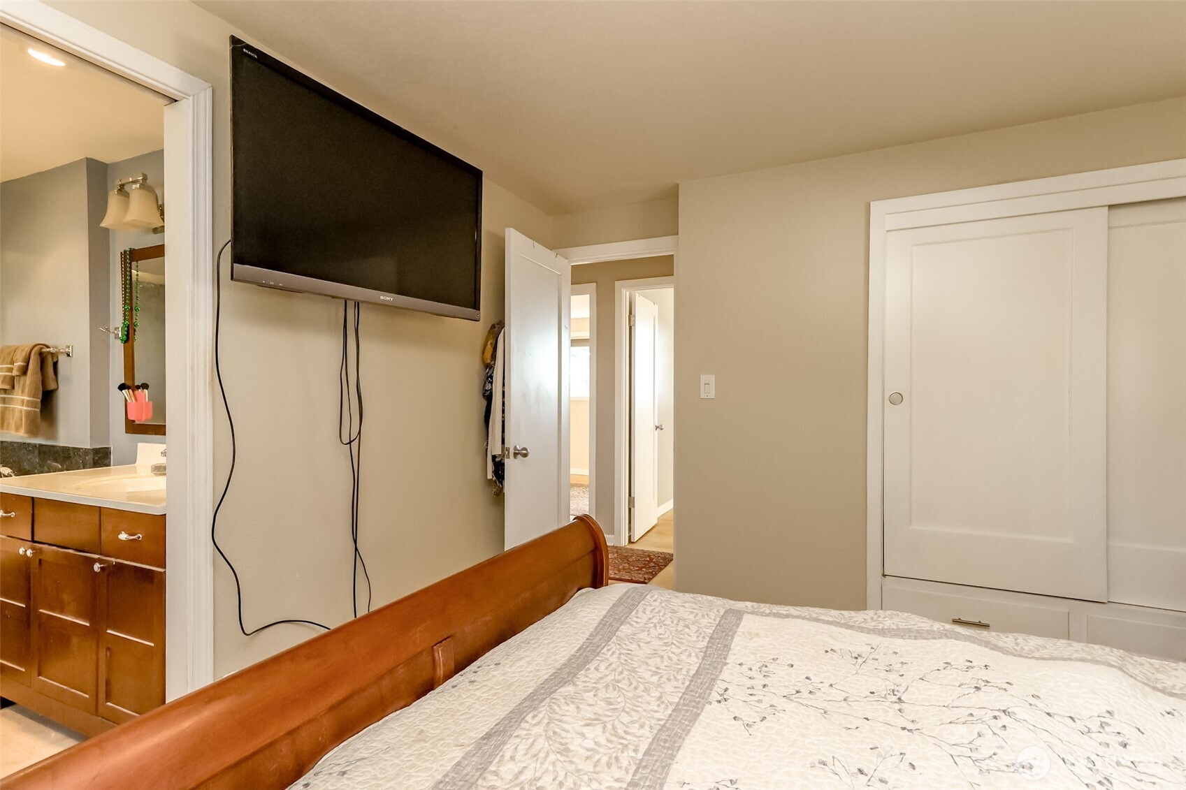 2424 Southwest 152nd Street Burien, WA 98166 - Photo 21 of 39 a bedroom with a bed and a flat screen tv