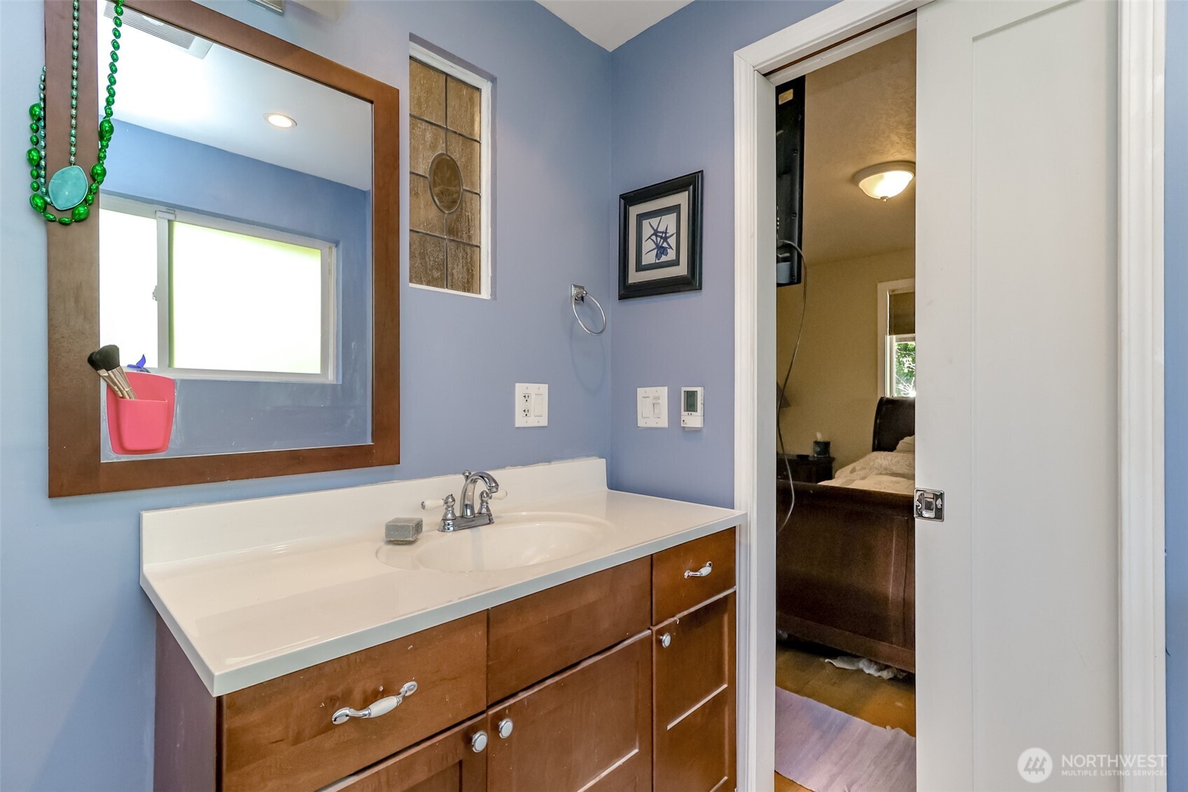 2424 Southwest 152nd Street Burien, WA 98166 - Photo 22 of 39 a bathroom with a sink vanity and a mirror