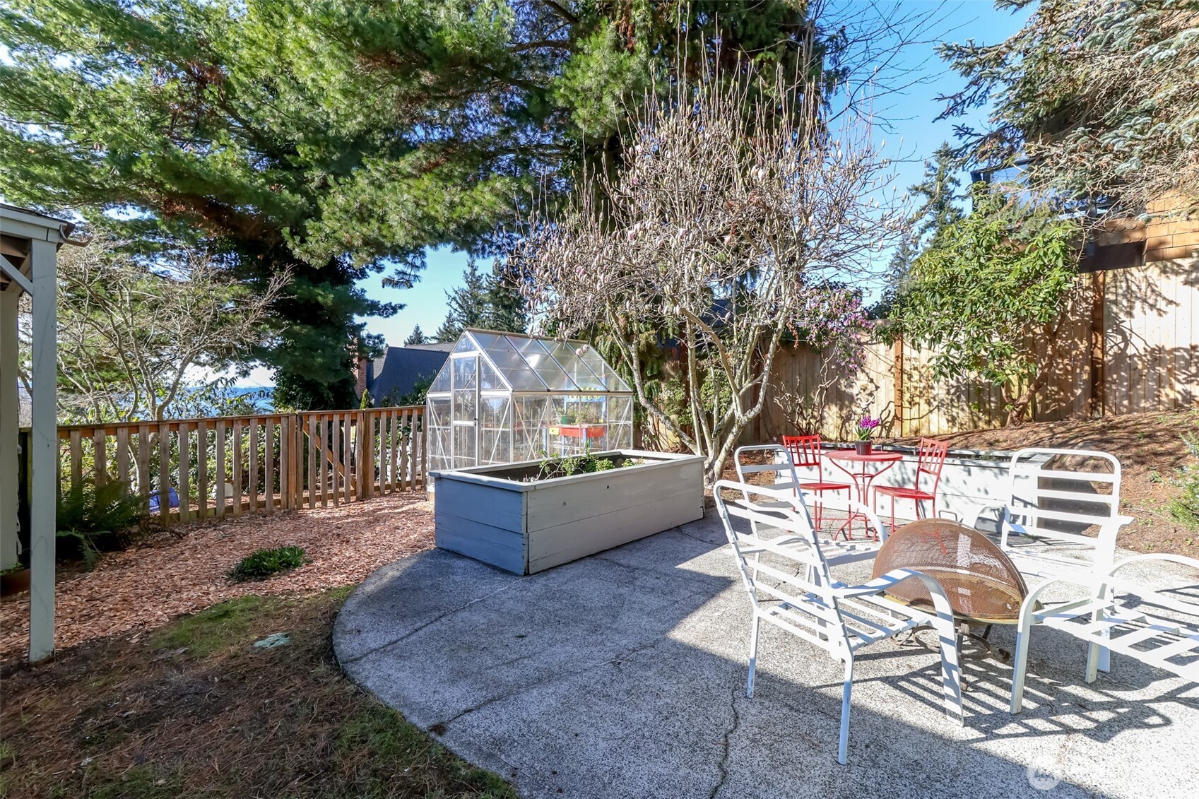 2424 Southwest 152nd Street Burien, WA 98166 - Photo 32 of 39 a view of a chairs and table in the backyard
