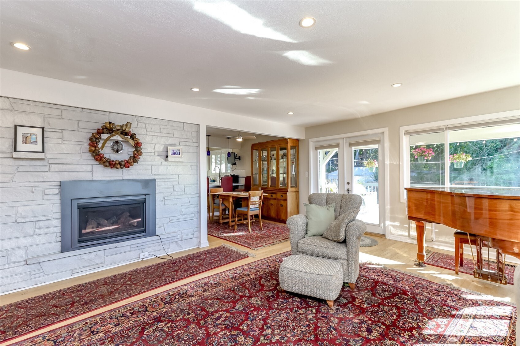 2424 Southwest 152nd Street Burien, WA 98166 - Photo 7 of 39 a living room with furniture and a fireplace