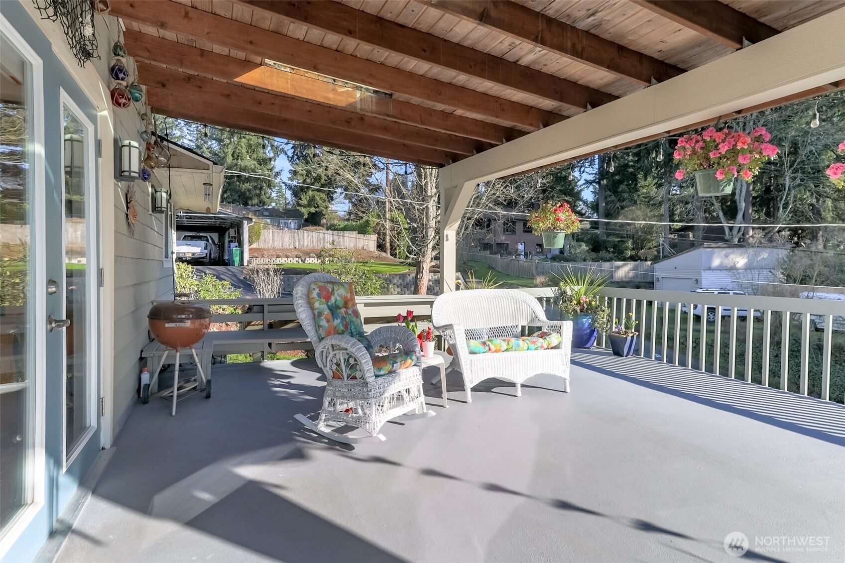2424 Southwest 152nd Street Burien, WA 98166 - Photo 10 of 39 a view of a patio with table and chairs and wooden floor