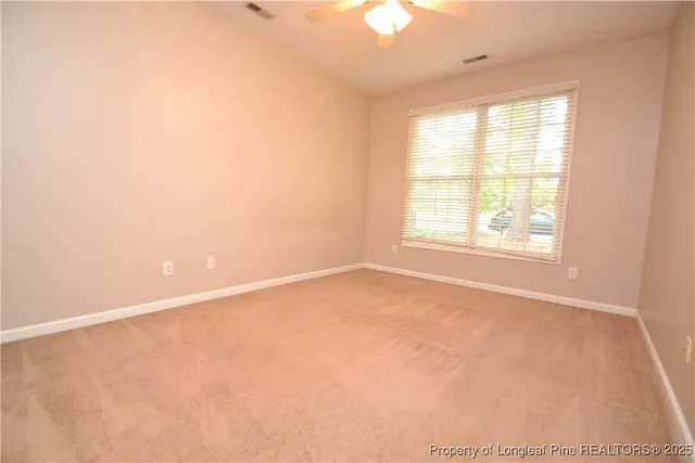 an empty room with a bathroom