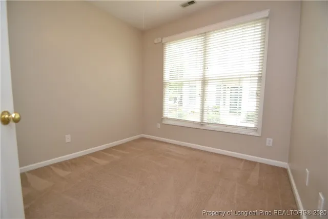 an empty room with closet area