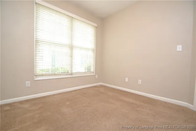 an empty room with closet area