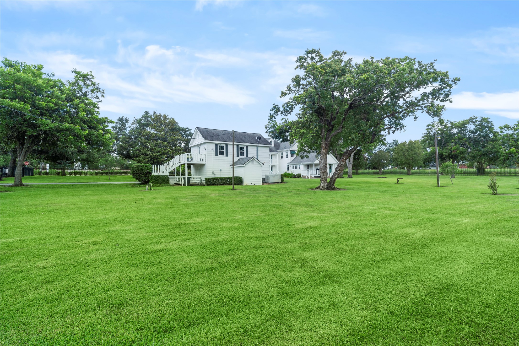 9827 FM 2759 Road Richmond, TX 77469 - Photo 46 of 50 a view of a house with a big yard and large trees