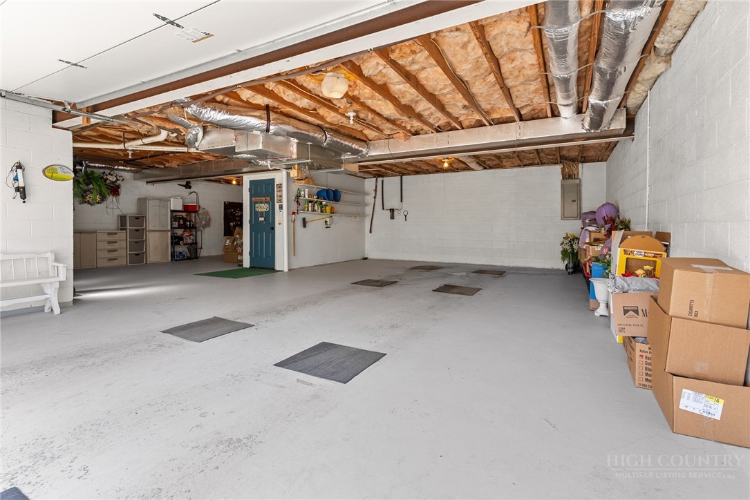 271 Quail Hollow Road Crumpler, NC 28617 - Photo 29 of 30 a view of a garage with table and chairs