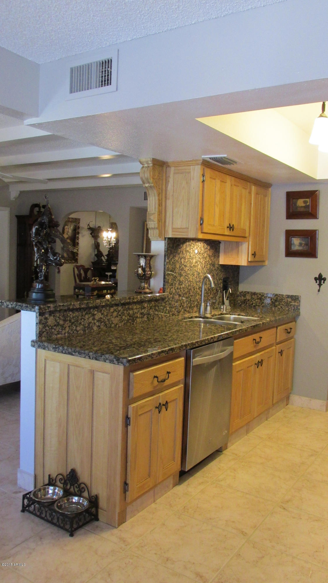 646 East Calavar Road Phoenix, AZ 85022 - Photo 8 of 29 a kitchen with sink and cabinets