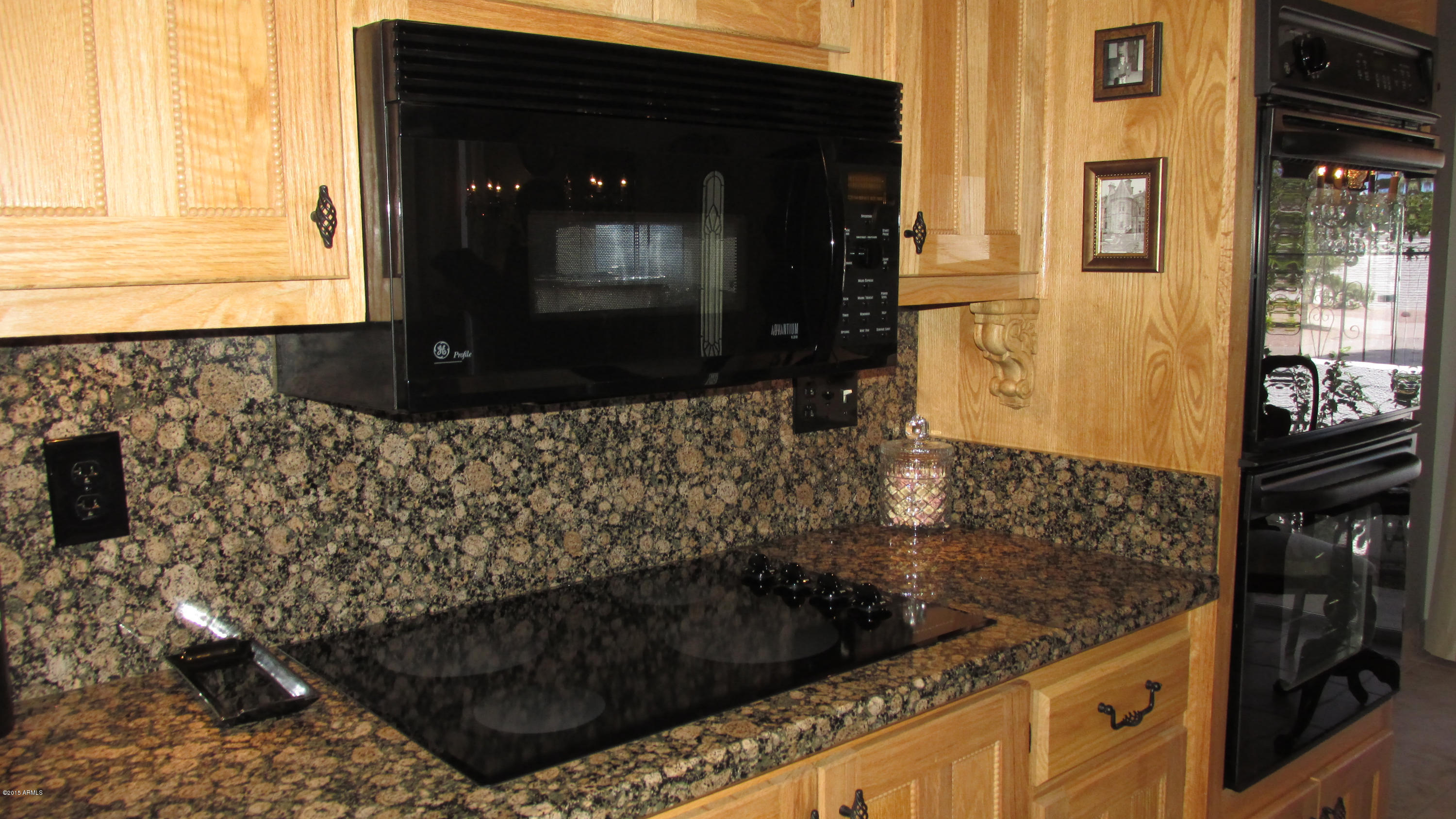 646 East Calavar Road Phoenix, AZ 85022 - Photo 9 of 29 a bathroom with a granite countertop sink a mirror and shower