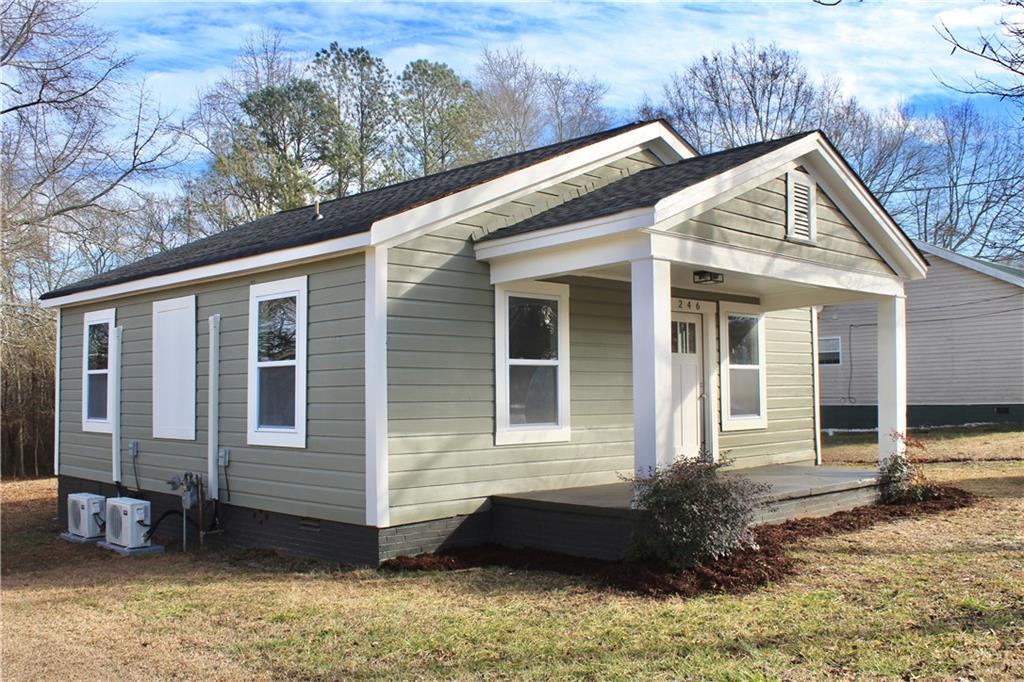 246 Shankle Road Commerce, GA 30529 - Photo 1 of 1 a front view of a house with garden