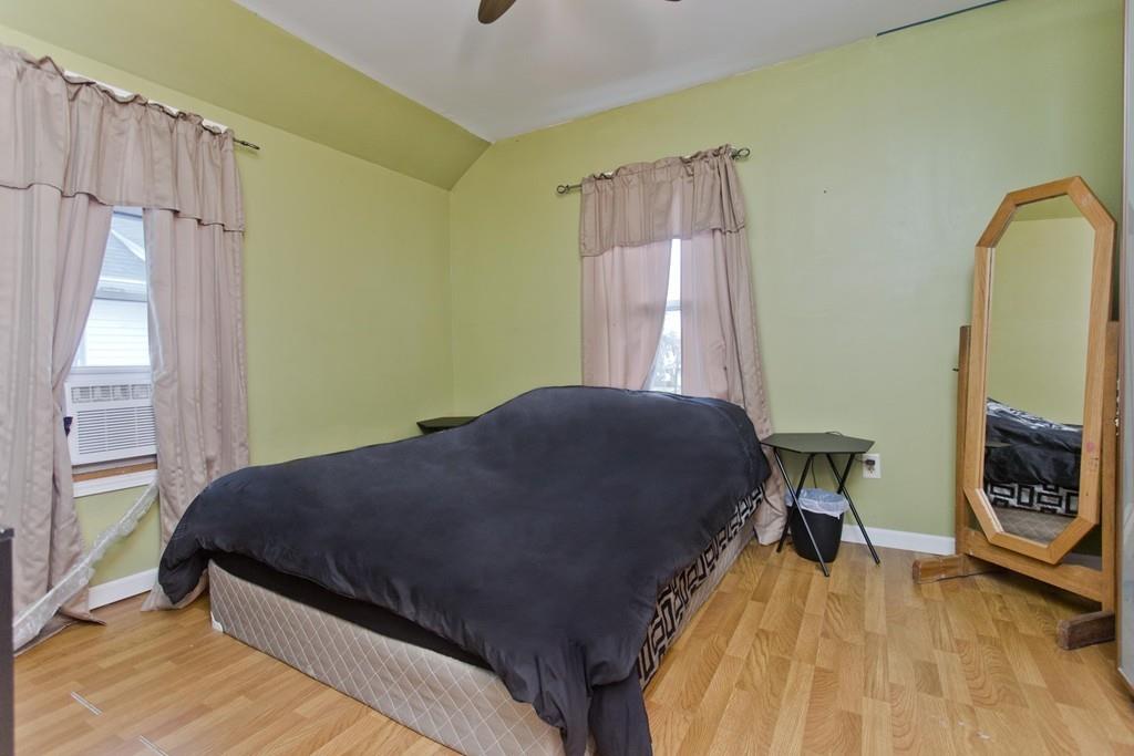 107 Ardmore Street Springfield, MA 01104 - Photo 21 of 30 a bedroom with a bed chair and a window