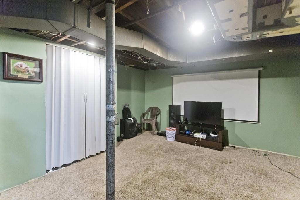 107 Ardmore Street Springfield, MA 01104 - Photo 25 of 30 a room with a flat screen tv and a fireplace