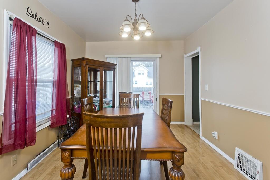 107 Ardmore Street Springfield, MA 01104 - Photo 8 of 30 a view of a dining room with furniture window and wooden floor
