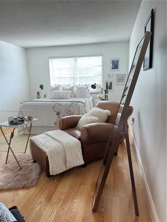 a room with a chair and a fireplace