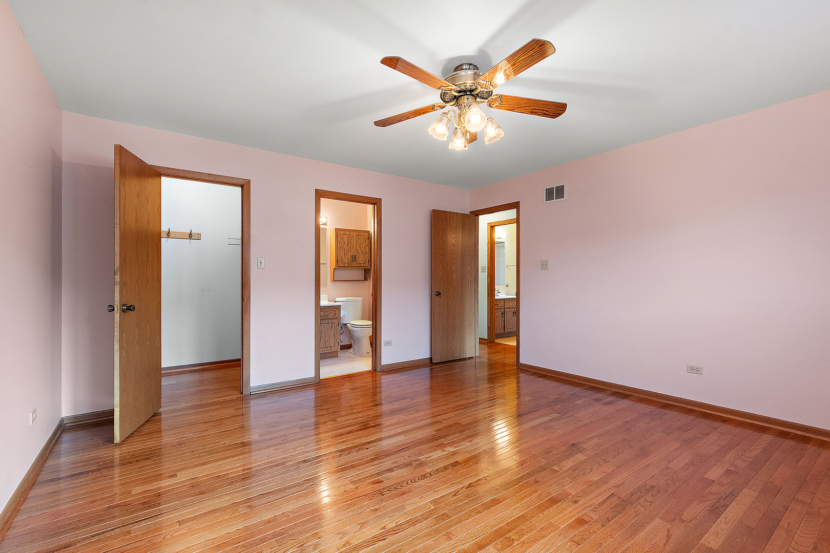 10459 Eagle Ridge Drive, Unit 139 Orland Park, IL 60467 - Photo 15 of 25 an empty room with wooden floor and windows