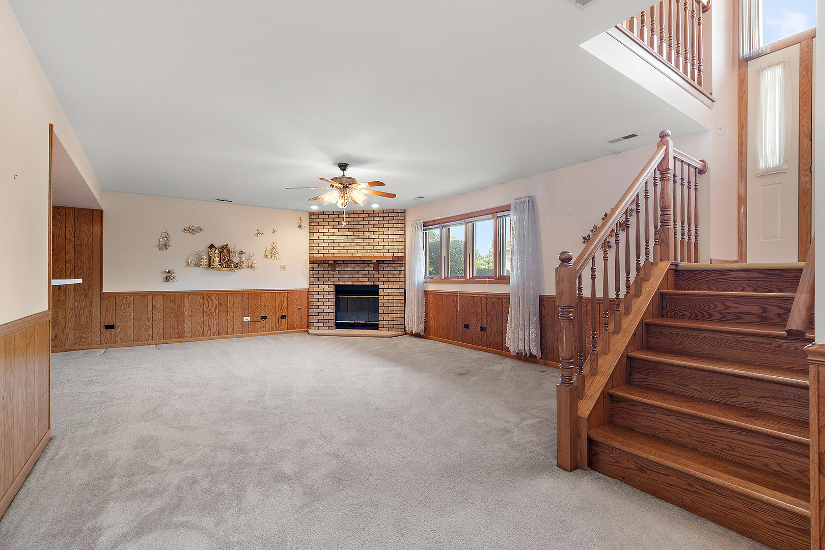 10459 Eagle Ridge Drive, Unit 139 Orland Park, IL 60467 - Photo 20 of 25 a view of an empty room with fireplace and stairs