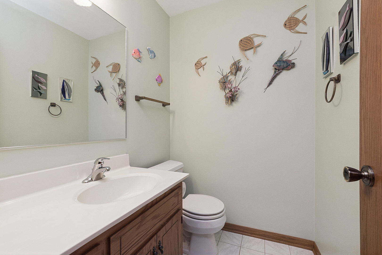 10459 Eagle Ridge Drive, Unit 139 Orland Park, IL 60467 - Photo 22 of 25 a bathroom with a sink mirror and toilet