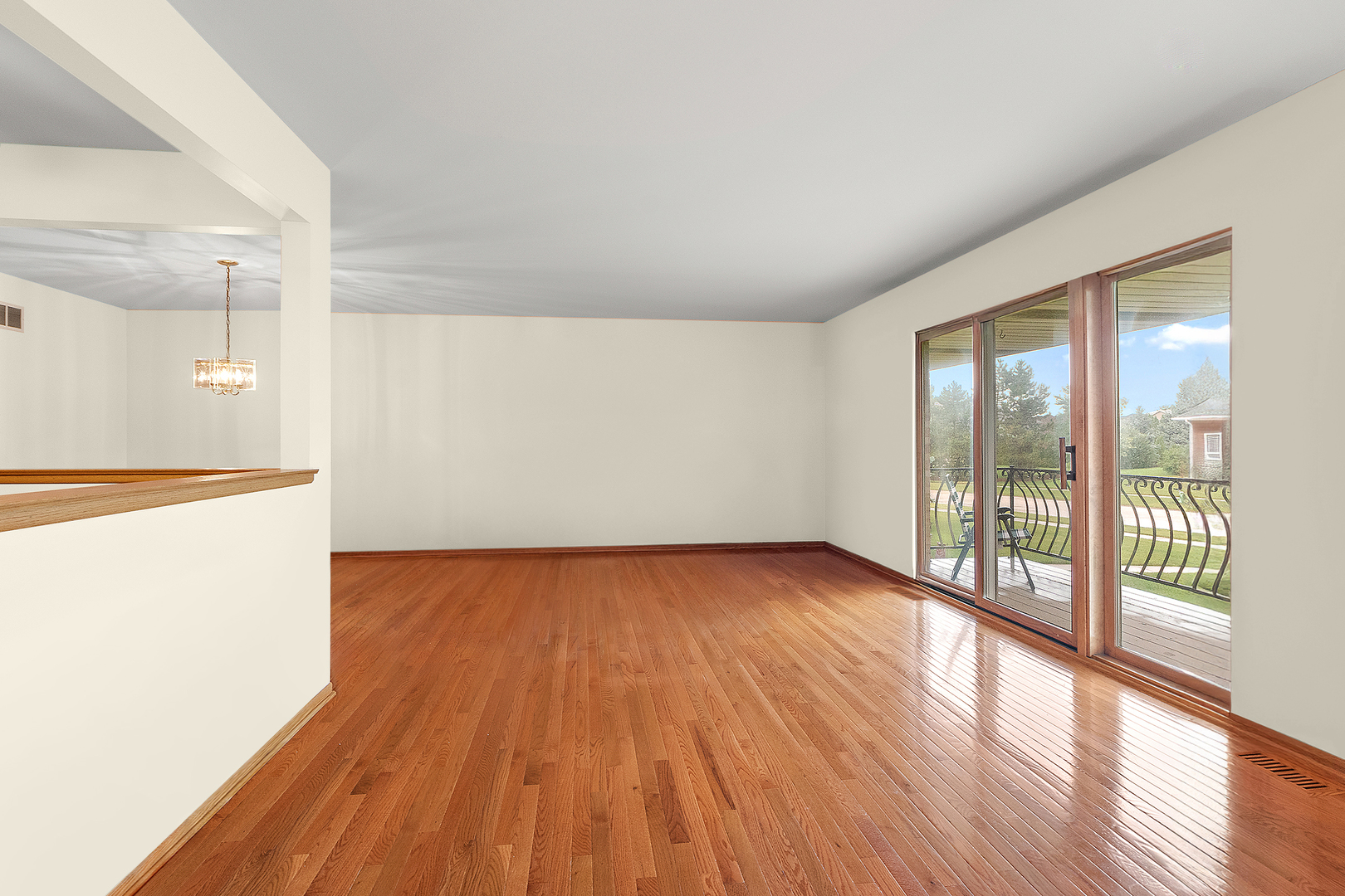 10459 Eagle Ridge Drive, Unit 139 Orland Park, IL 60467 - Photo 3 of 25 a view of an empty room with wooden floor and a window