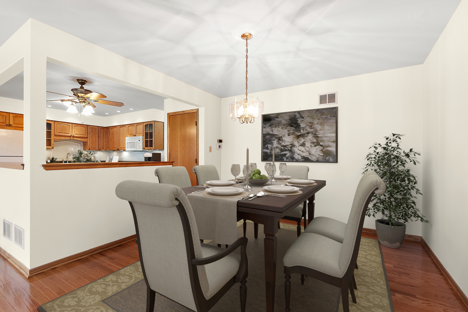 10459 Eagle Ridge Drive, Unit 139 Orland Park, IL 60467 - Photo 6 of 25 a view of a dining room with furniture and wooden floor