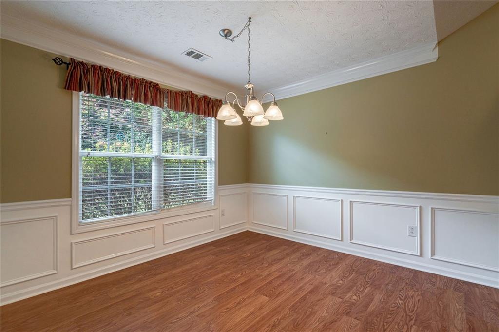 245 Memory Lane Winder, GA 30680 - Photo 22 of 62 a view of a room with wooden floors and white walls