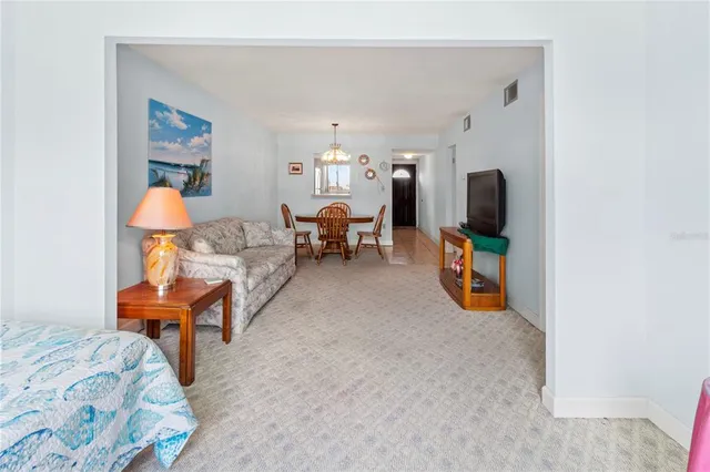 a room with furniture and a flat screen tv