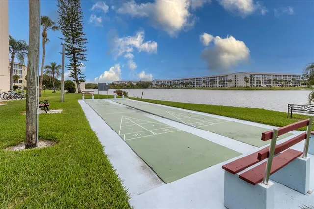 a view of a swimming pool with a yard