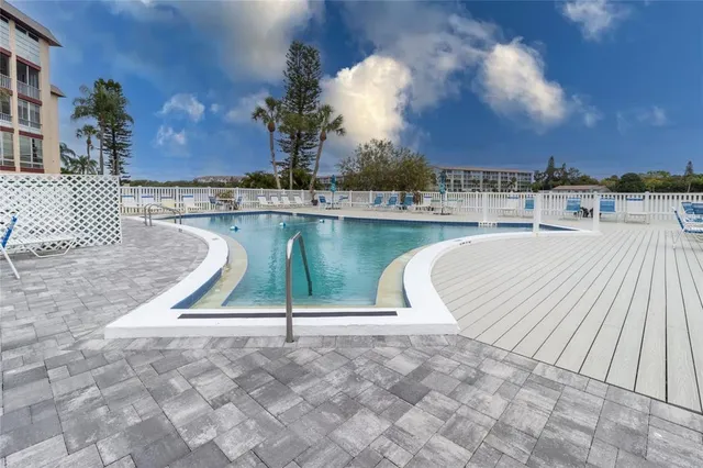 a view of a yard with wooden fence