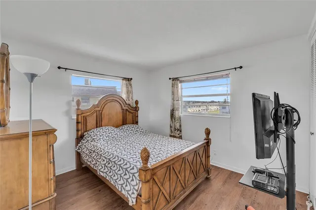 a bathroom with a shower sink mirror and toilet