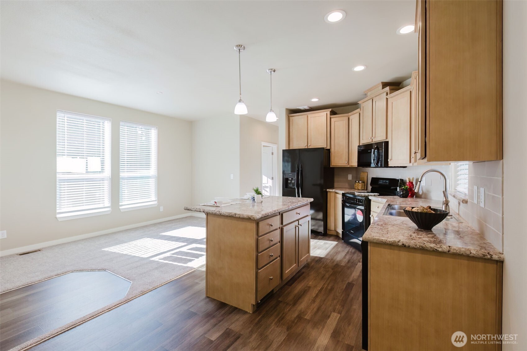 3371 Southeast Bielmeier Road, Unit 95 Port Orchard, WA 98367 - Photo 19 of 40 a kitchen with stainless steel appliances granite countertop a sink stove and refrigerator