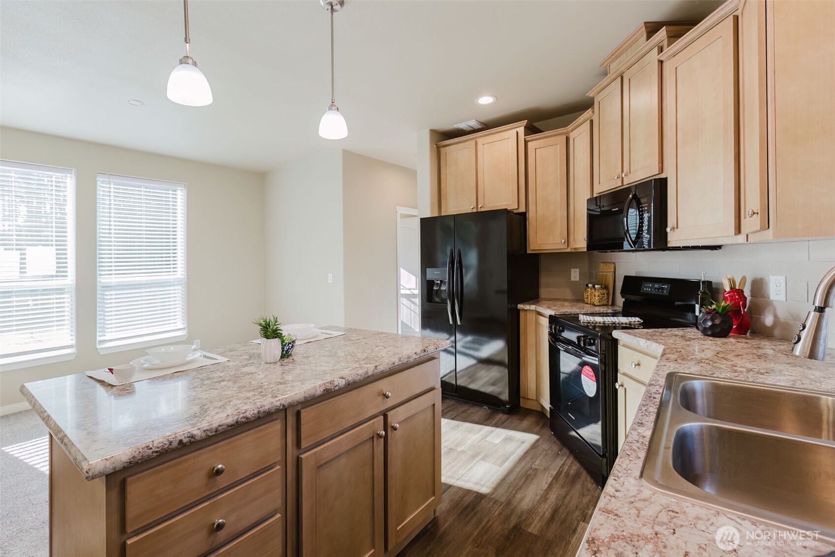 3371 Southeast Bielmeier Road, Unit 95 Port Orchard, WA 98367 - Photo 21 of 40 a kitchen with stainless steel appliances granite countertop a sink stove and refrigerator
