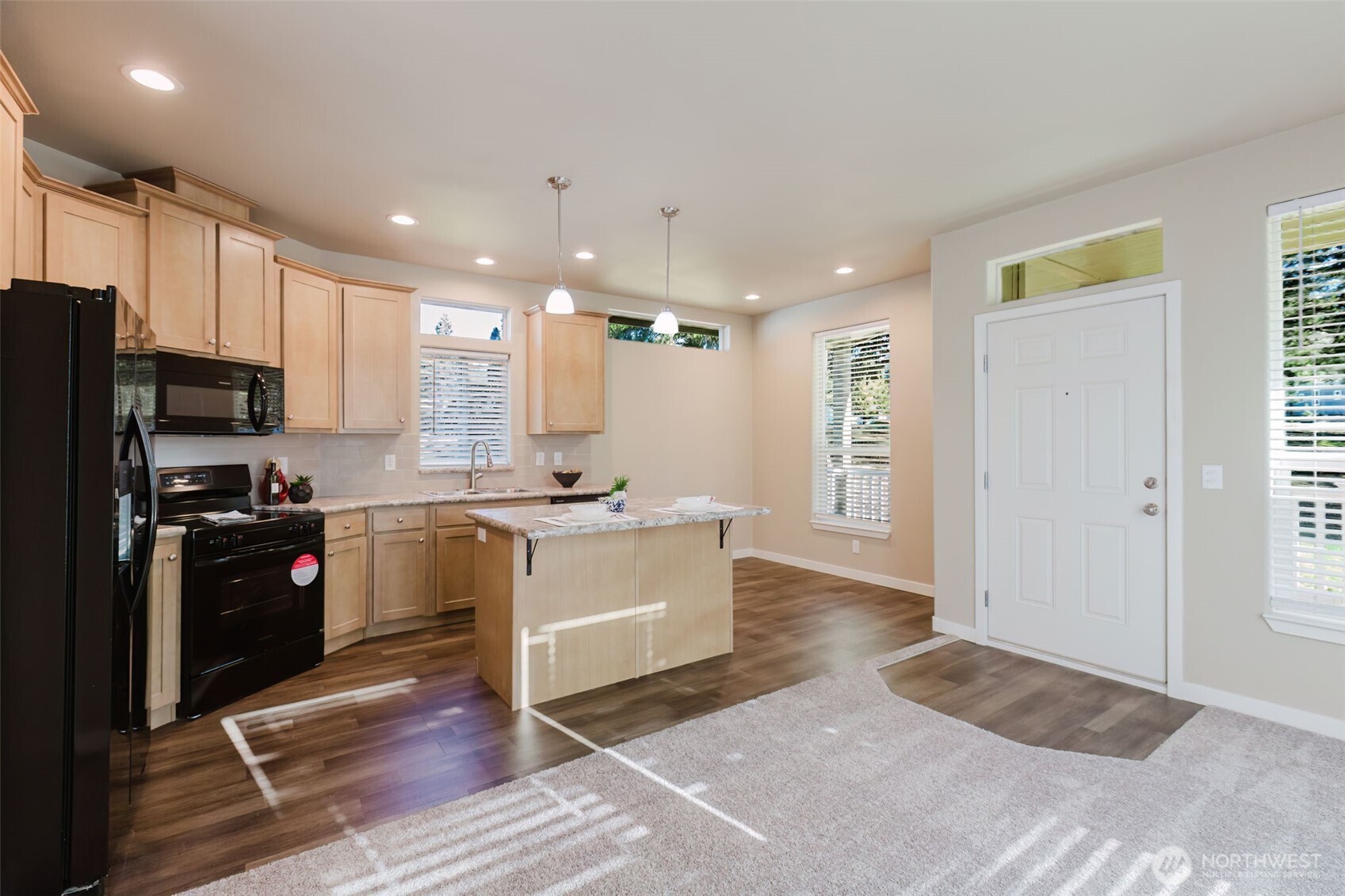 3371 Southeast Bielmeier Road, Unit 95 Port Orchard, WA 98367 - Photo 22 of 40 a large kitchen with a refrigerator and a stove top oven