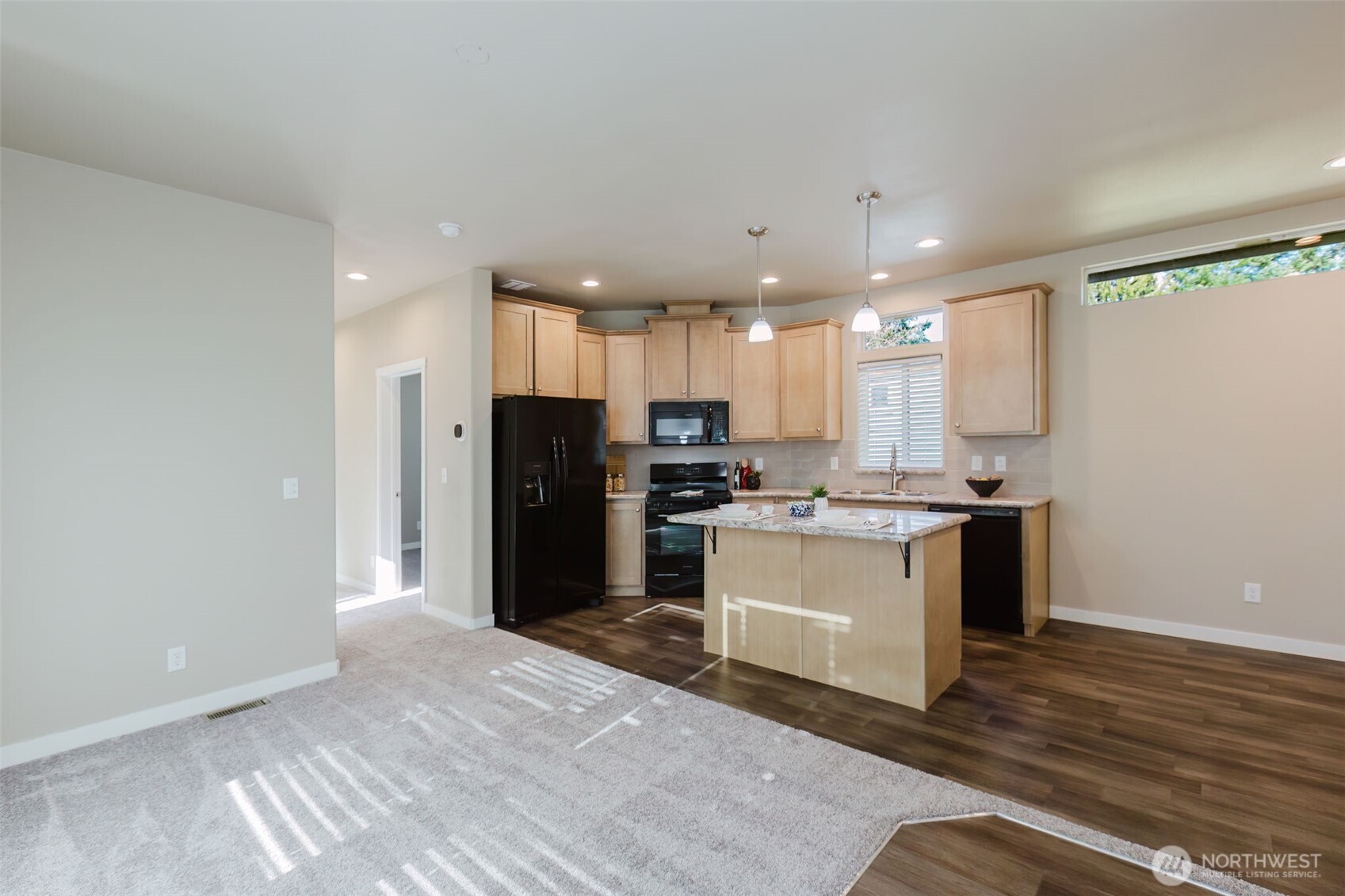 3371 Southeast Bielmeier Road, Unit 95 Port Orchard, WA 98367 - Photo 24 of 40 a kitchen with a refrigerator and a sink