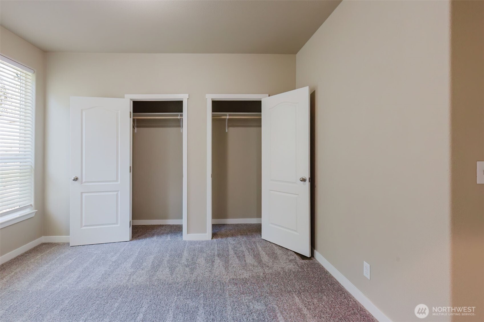 3371 Southeast Bielmeier Road, Unit 95 Port Orchard, WA 98367 - Photo 37 of 40 an empty room with closet and wooden floor
