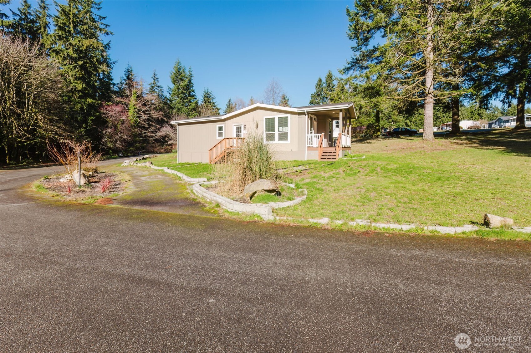 3371 Southeast Bielmeier Road, Unit 95 Port Orchard, WA 98367 - Photo 40 of 40 a view of a house with backyard and trees