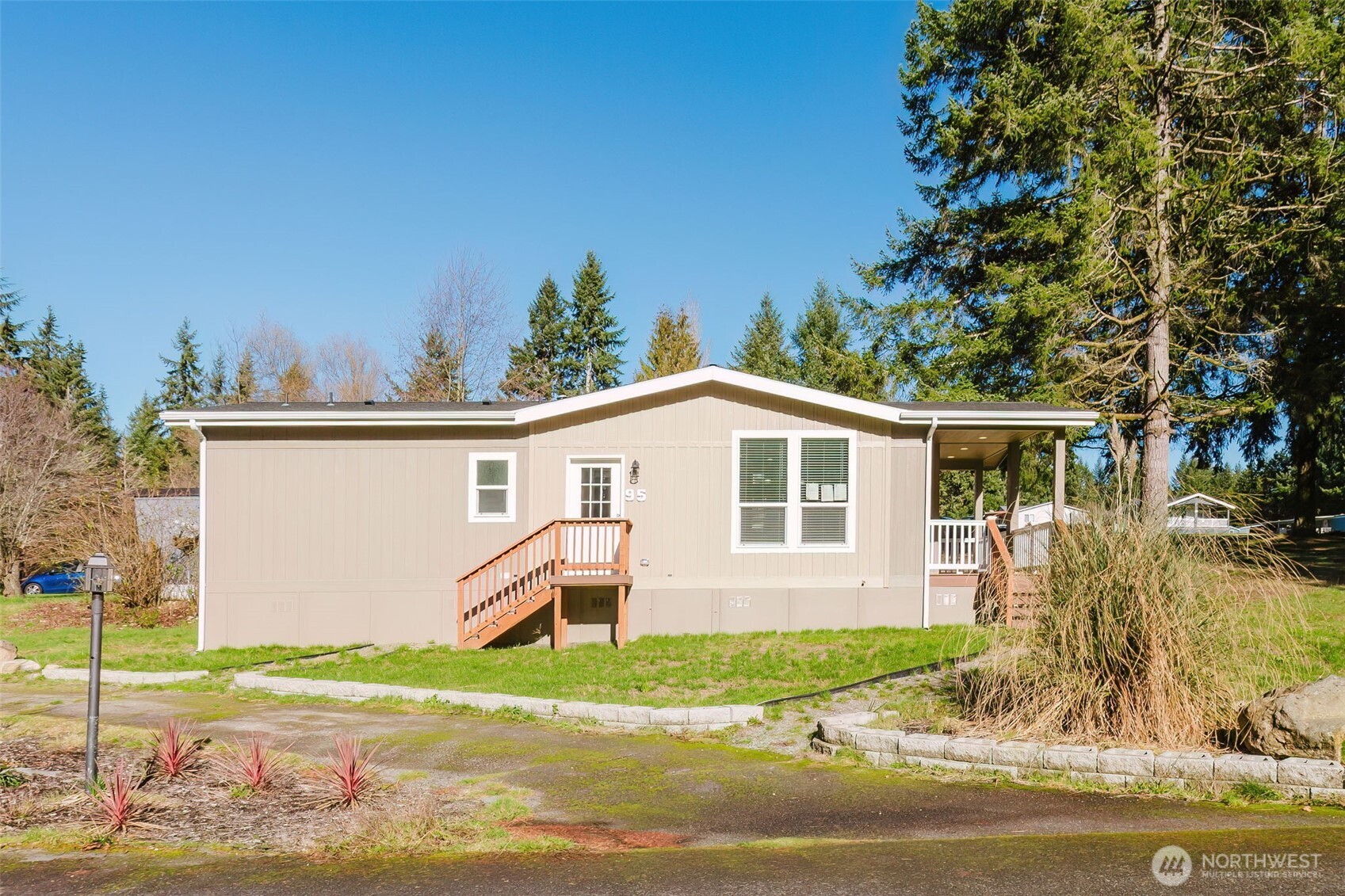 3371 Southeast Bielmeier Road, Unit 95 Port Orchard, WA 98367 - Photo 4 of 40 a front view of a house with garden