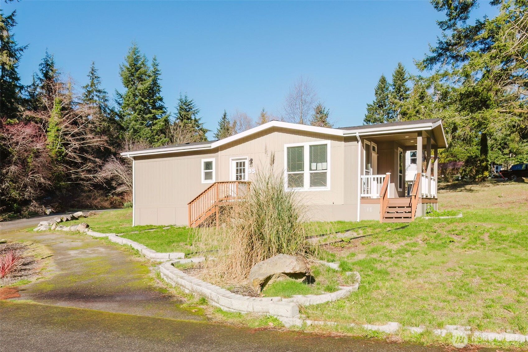 3371 Southeast Bielmeier Road, Unit 95 Port Orchard, WA 98367 - Photo 5 of 40 a view of a house with a yard