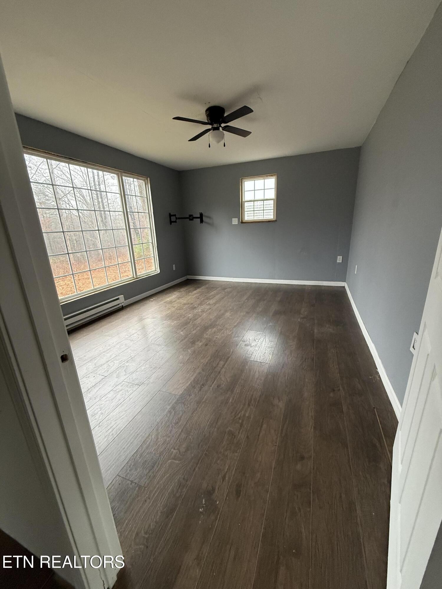 321 Wheeler Lane Jamestown, TN 38556 - Photo 17 of 23 a view of wooden floor and windows in a room