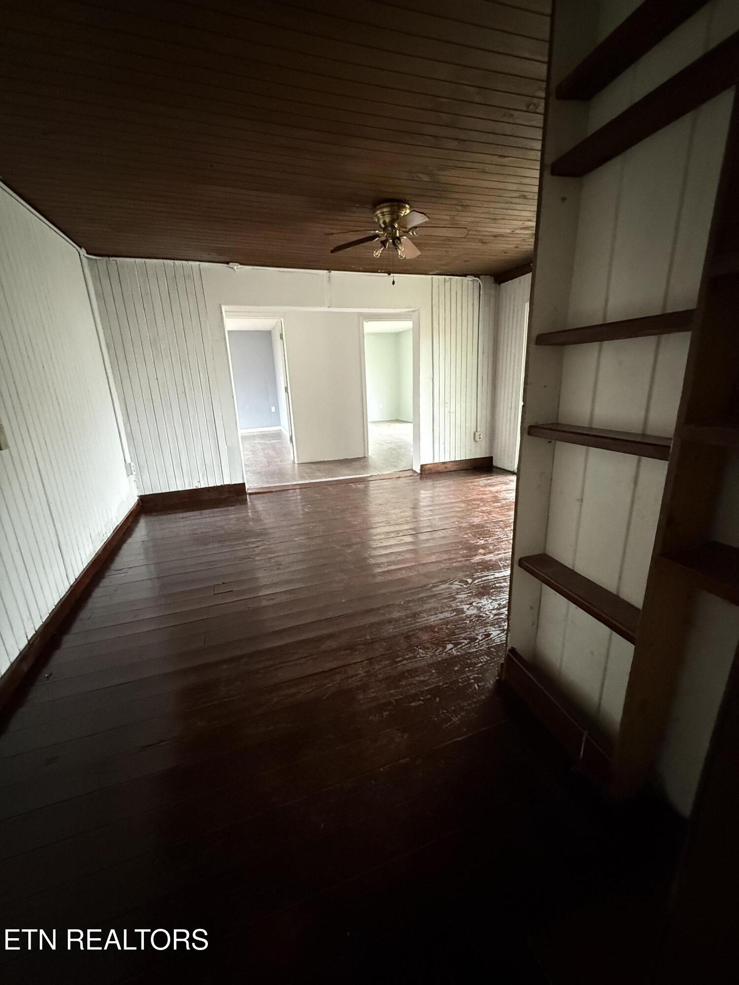 321 Wheeler Lane Jamestown, TN 38556 - Photo 22 of 23 a view of empty room with wooden floor and fan
