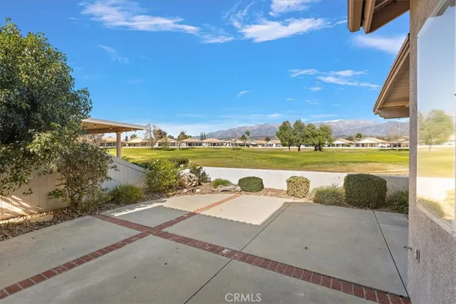 a view of a lake with couches in front of house