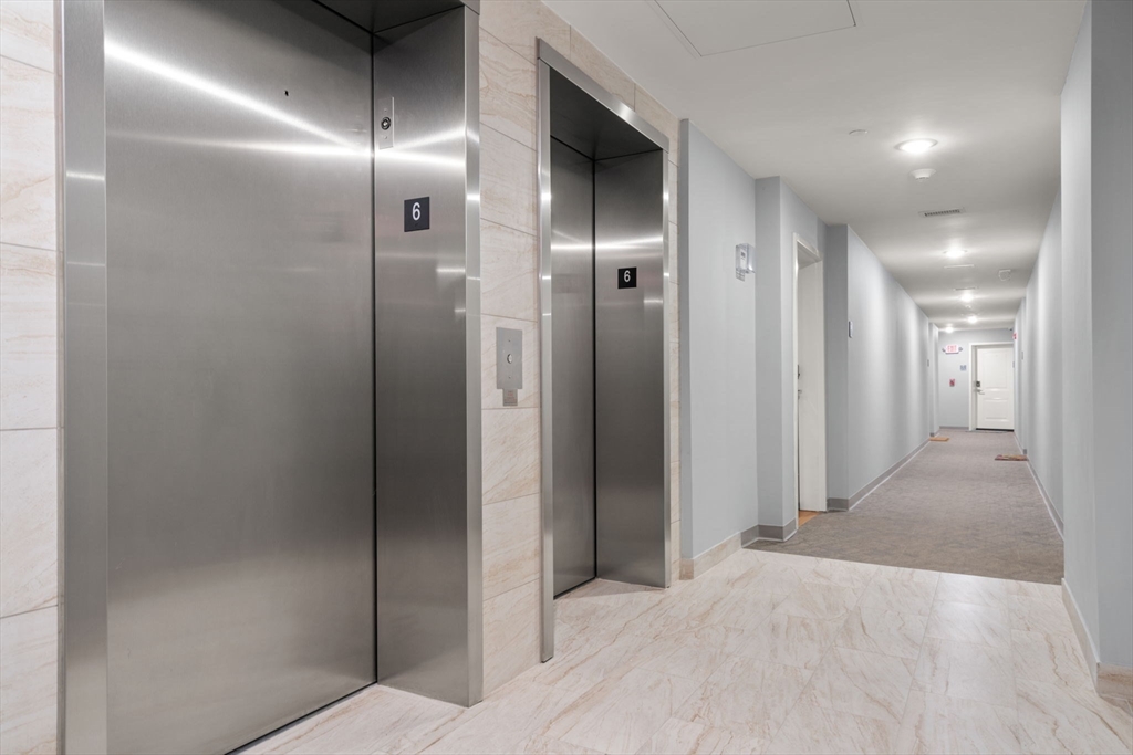 10 Taber Street, Unit 503 Boston, MA 02119 - Photo 19 of 21 a view of a hallway