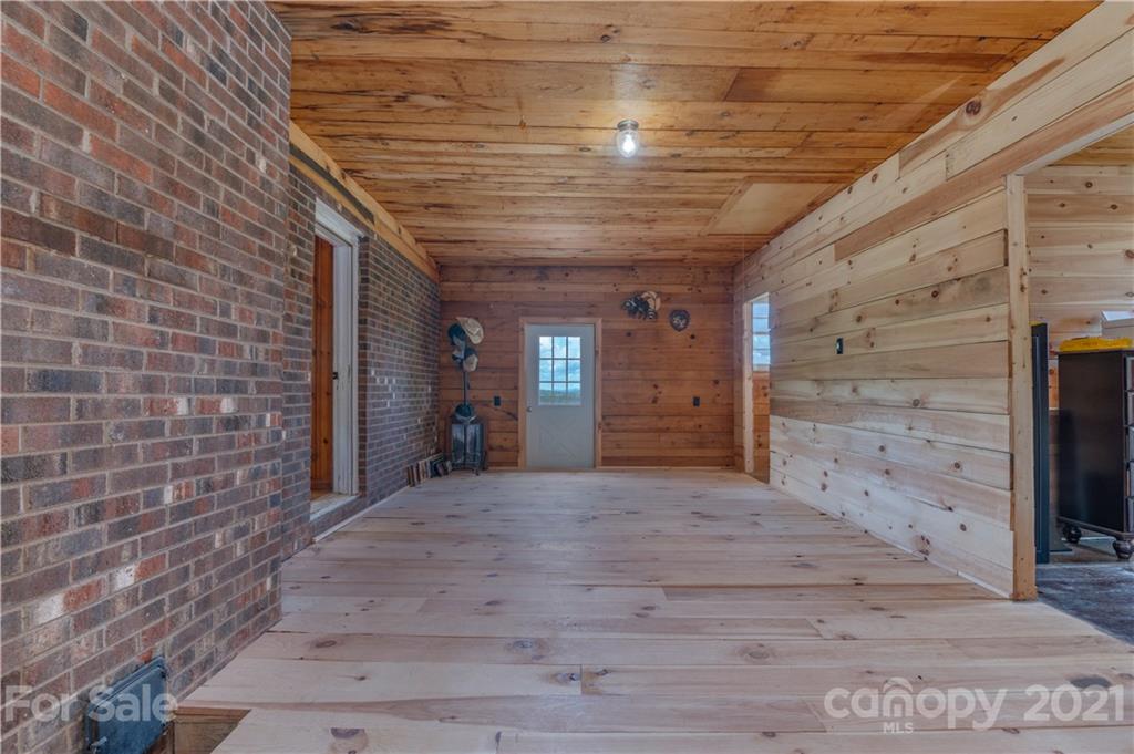 2310 Cove Road Rutherfordton, NC 28139 - Photo 22 of 40 a view of an empty room with wooden floor and a window