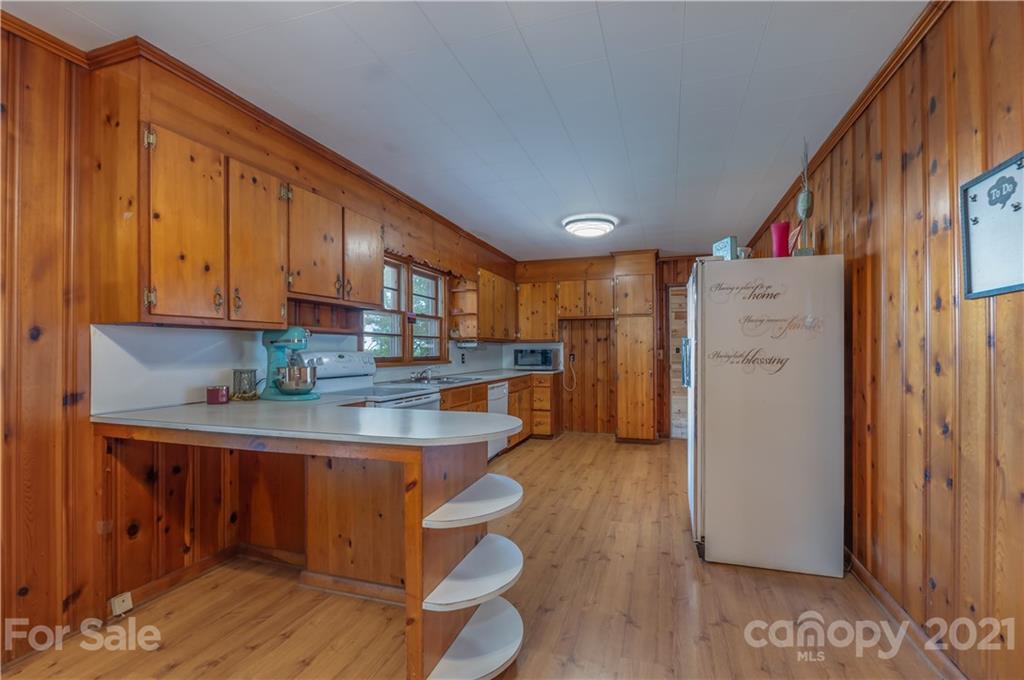 2310 Cove Road Rutherfordton, NC 28139 - Photo 8 of 40 a kitchen with stainless steel appliances granite countertop a refrigerator sink and cabinets