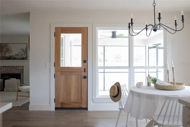 a view of a dining room with furniture window and wooden floor