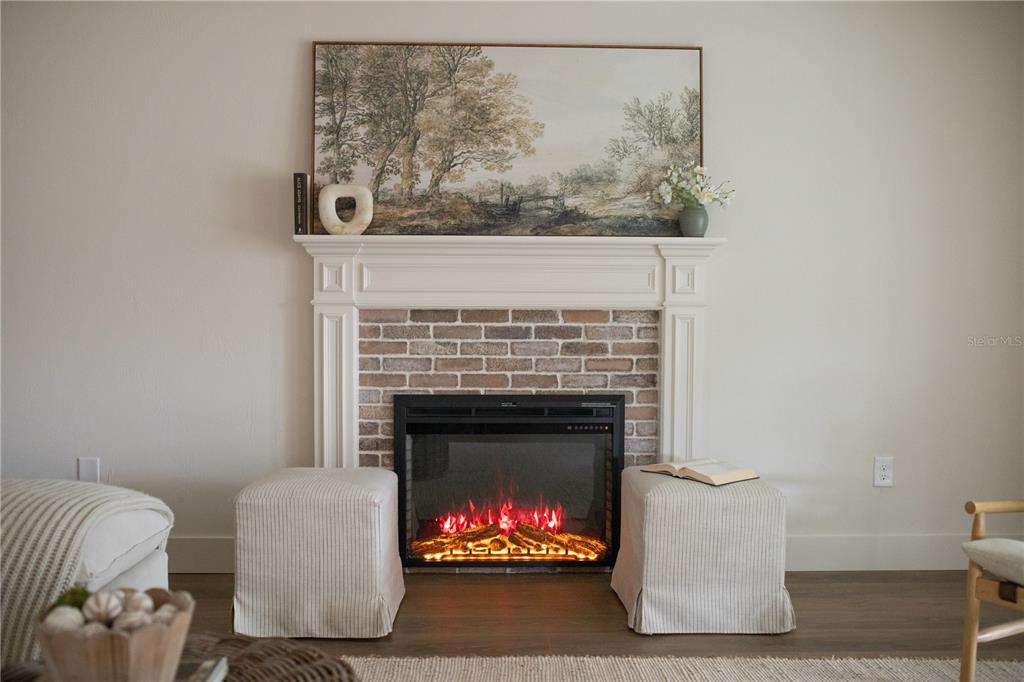 320 Rodeo Road Ormond Beach, FL 32174 - Photo 13 of 53 a living room with furniture and a fireplace