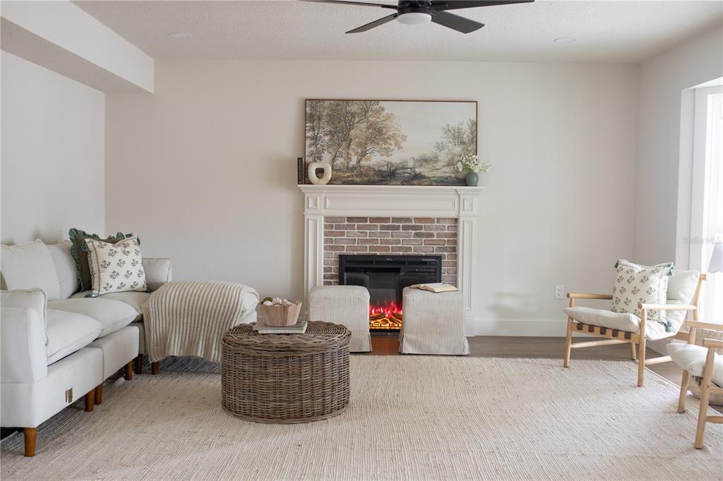 320 Rodeo Road Ormond Beach, FL 32174 - Photo 14 of 53 a living room with furniture and a fireplace